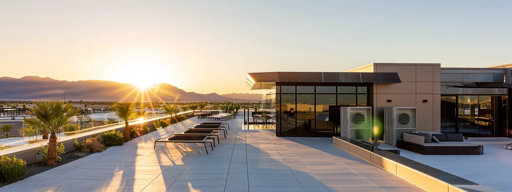 a sun-drenched las vegas rooftop showcases a sleek, newly installed hvac unit surrounded by vibrant desert landscape, emphasizing the importance of regular maintenance for optimal savings.